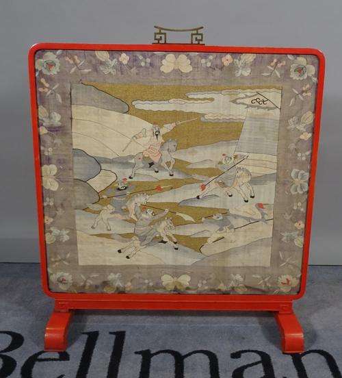 A Chinese silk work panel within a red metal frame.  B4