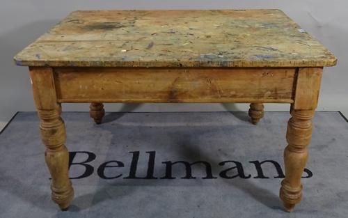 An early 20th century pine low table on ring turned supports, 114cm wide x 68cm high.  C5