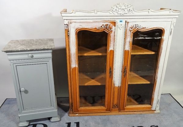 A 20th century French display cabinet with arched panelled glazed doors, 100cm wide x 109cm high and a grey painted marble topped bedside table, (2).