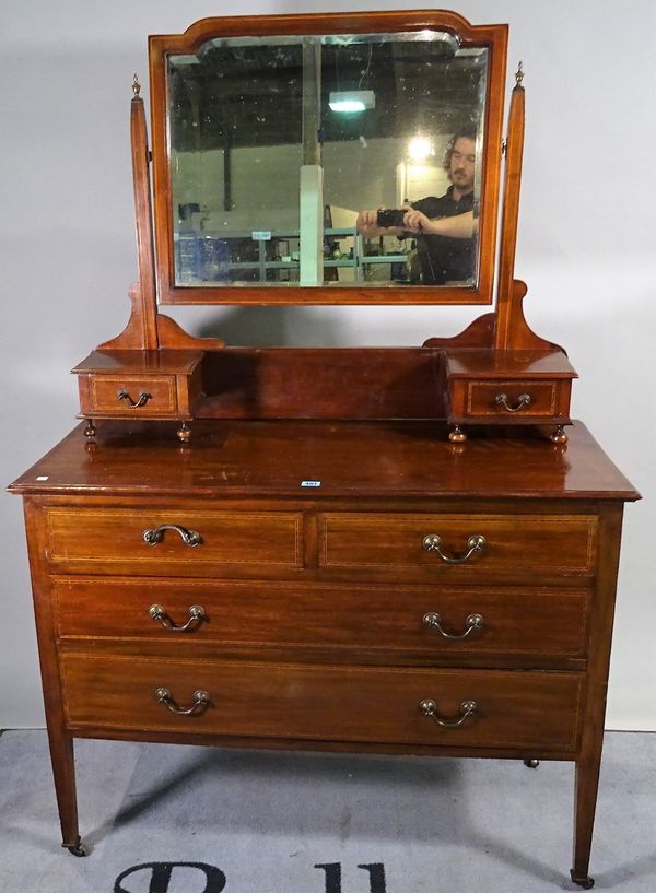 An Edwardian inlaid mahogany dressing chest with rectangular mirror and two short and two long drawers, 106cm wide x 150cm high. D1