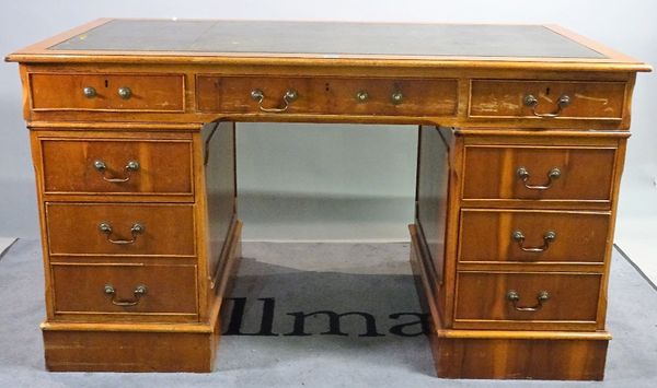 A 20th century mahogany pedestal desk with nine drawers about the knee and green leather inset top, 139cm wide x 80cm high. D1