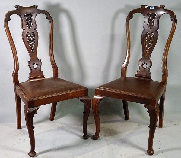 A set of four Queen Anne style mahogany vase back dining chairs, 48cm wide x 105cm high, (4).  C4