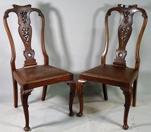 A set of four Queen Anne style mahogany vase back dining chairs, 48cm wide x 105cm high, (4).  C4