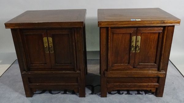 A pair of 20th century Eastern elm two door side cabinets on block supports, 61cm wide x 74cm high. D3