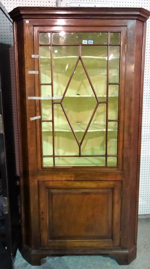 An 18th century mahogany corner display cabinet cupboard, the single astragal door over panel cupboard, 101cm wide x 192cm high.  A3