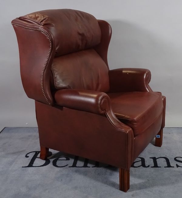 A modern hardwood framed reclining wingback armchair, 88cm wide x 100cm high.  B5