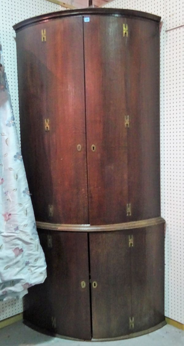 A late 18th century oak floor standing double height corner cupboard, 117cm wide x 223cm high.  D5