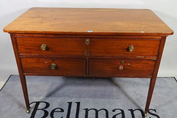 A 19th century mahogany sideboard/ serving table, the drop dummy drawer, with pull-out interior over a pair of short drawers, on tapering square suppo