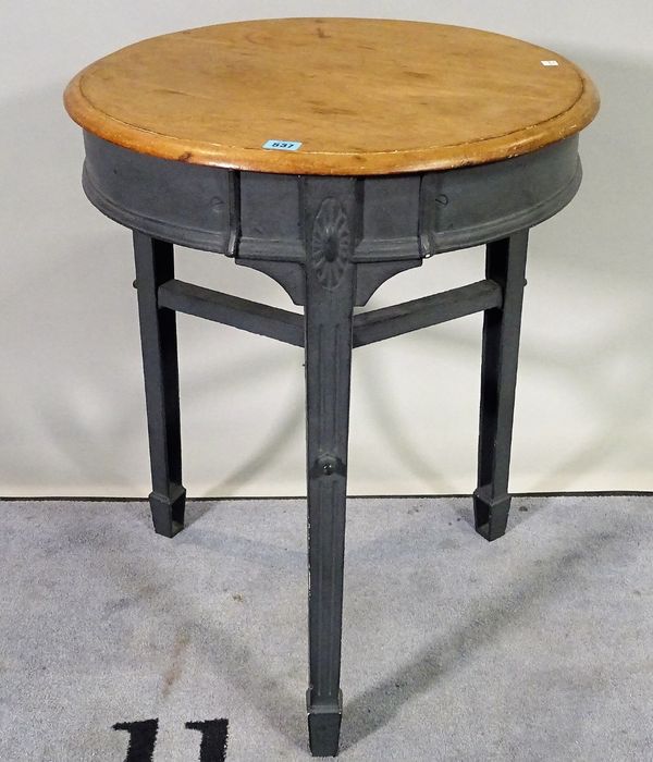 A circular occasional table, with stripped mahogany top on a grey painted cast iron base, with three block supports, 58cm diameter x 71cm high.  B2