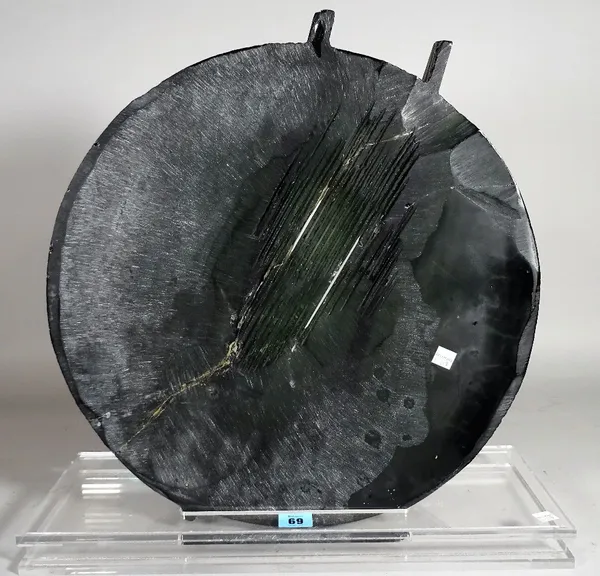 A modern circular black glass abstract sculpture on a perspex base, 46cm diameter x 44cm high, (a.f.).  D2