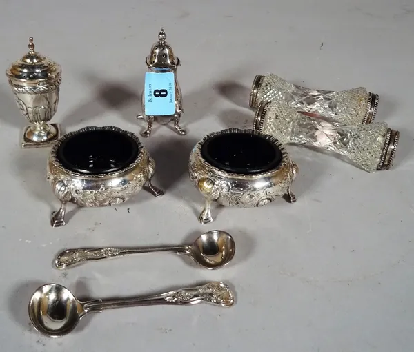 A pair of Victorian silver salts of cauldron form, with blue glass liners, a silver pepperette of campana form, a pair of silver mounted and cut glass