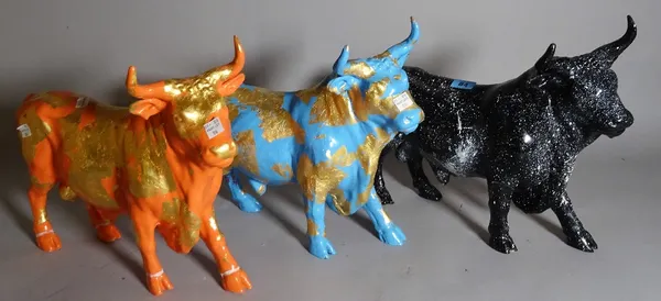A group of three 20th century painted composite figures of a bull, each individually painted, signed and numbered, 'Krunic', 37cm wide x 31cm high, (a