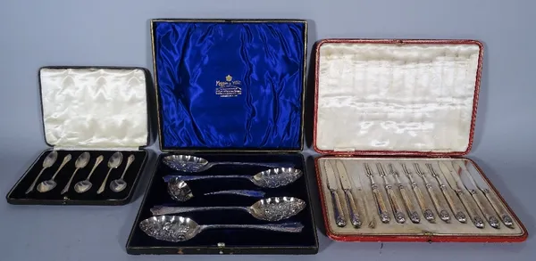 A set of six silver teaspoons, a twelve piece fruit knife and fork set (one knife lacking), cased, and a silver plated berry spoon set, cased, (3). CA
