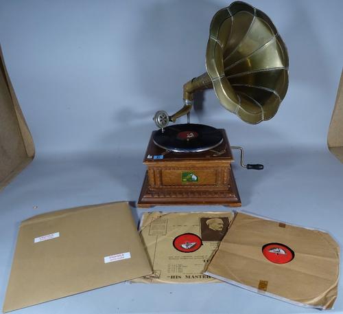 A 20th century gramophone and three records, 35cm wide x 62cm high.   B2