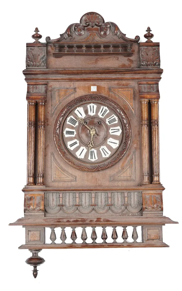 A Black Forest style cuckoo clock of typical form (57cm high) (Pendulum) and a French walnut wall clock of architectural form (85cm high) (2 keys and