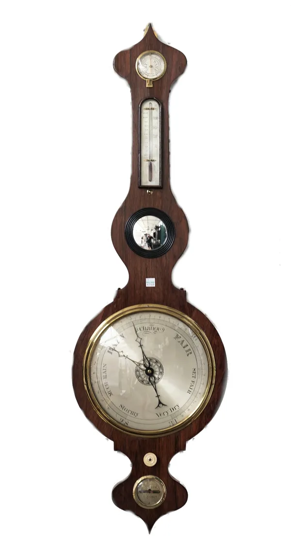 A Victorian rosewood wheel barometer with dry/damp detector thermometer, bulls eye mirror, silvered dial and level. 105cm high.