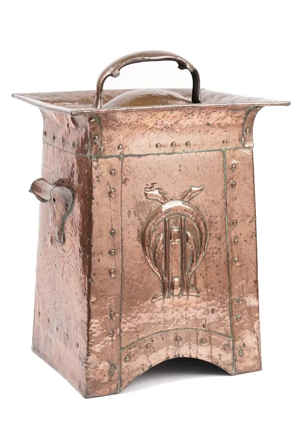 A Newlyn style copper coal purdonium and cover, later 19th/early 20th century, Art Nouveau beaten copper finish with stylised central embossed decorat