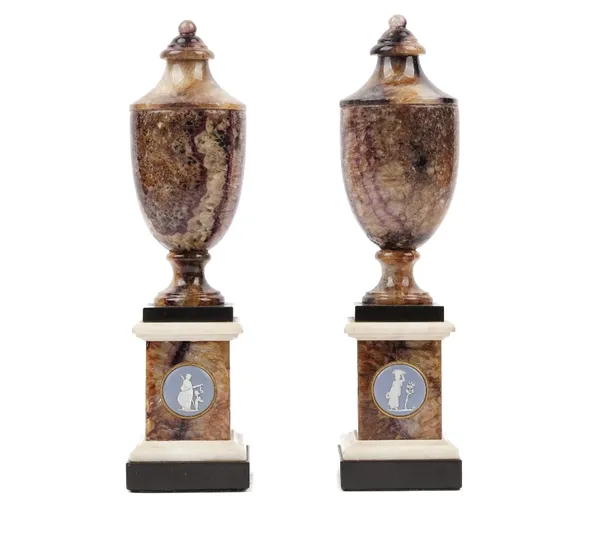 A pair of George III Blue john Derbyshire spa, marble and jasperware-mounted urns, the circular plaques perhaps by Wedgwood & Bentley, circa 178025 cm