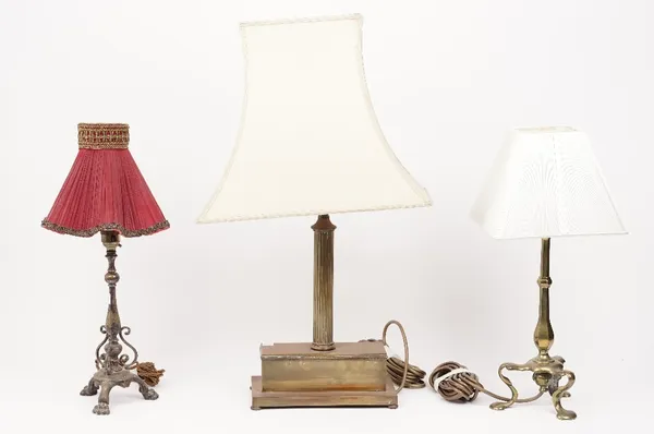 A Victorian style gilt metal table lamp of fluted column form, 60cm high overall, and two further smaller brass table lamps, (3).