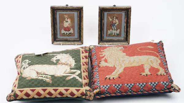 Two woolwork cushions depicting a unicorn and a lion, 40cm x 40cm, and a pair of woolwork figural embroidered pictures in wooden frames, 21cm x 17cm,