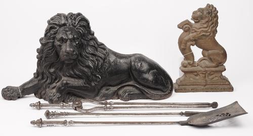 A set of three Georgian steel fire irons, 76cm, a Victorian black painted cast iron 'Lion' form door stop, 72cm wide, and a gilt painted cast iron 'li