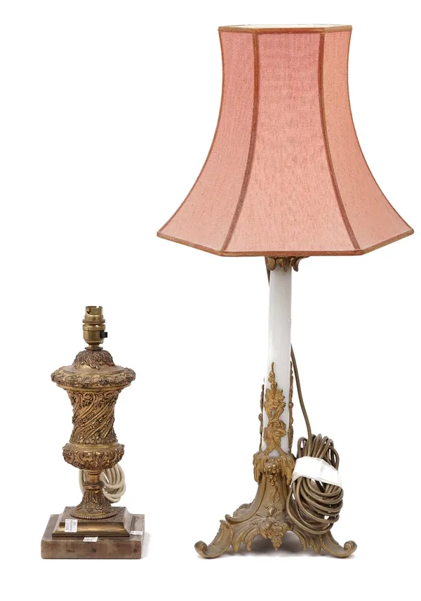 A Victorian style gilt metal and faux marble mounted table lamp, on a foliate cast triform base and a gilt metal urn form table lamp, (2).