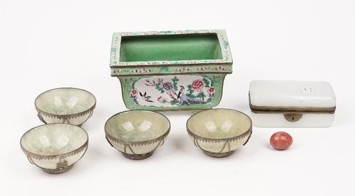 A modern Chinese enamel jardiniere of rectangular form decorated with flora and fauna against a green ground, 21cm wide, four Chinese green hardstone