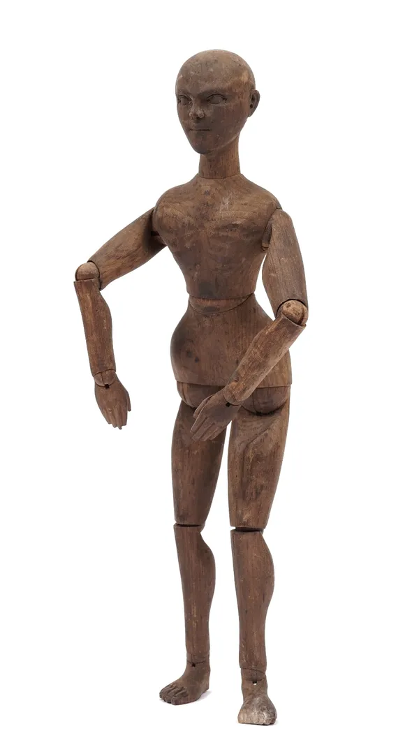 An artist's beechwood lay figure or mannequin, early 20th century, with jointed head, body and limbs, 33cm.