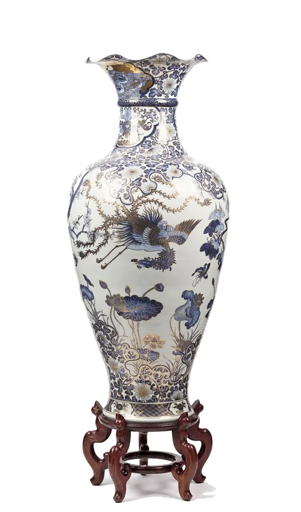 A large modern Chinese vase of baluster form, gilt blue decorated with exotic birds and flowers, 120cm high with a hardwood stand, (2).