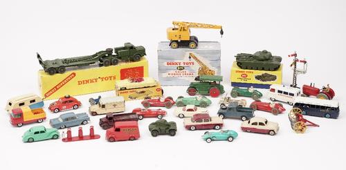A quantity of mainly Dinky die-cast vehicles including; a 660 Tank transporter, boxed, a 131 Cadillac tourer, boxed, a 131 Cadillac tower, boxed, a 65