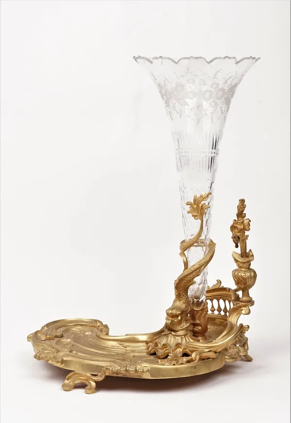 An ormolu and glass Louis XV style vase, with an asymmetrical foliate cast base, 51cm high.