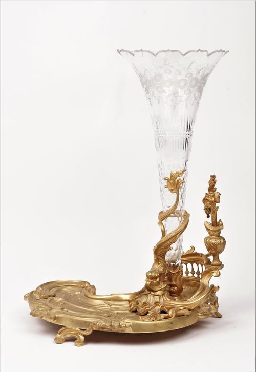 An ormolu and glass Louis XV style vase, with an asymmetrical foliate cast base, 51cm high.
