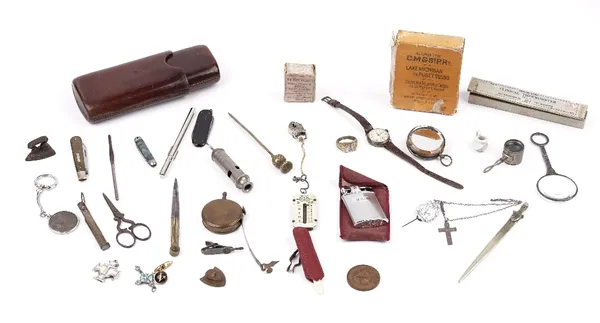 A small group of collectables, including; a leather cigar case, a small magnifying lens, a silver cased wristwatch, a brass tape measure, a letter ope