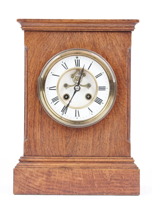 An Edwardian oak cased mantel clock with visible brocot escapement, and a French two train movement with hammer striking a coiled gong, 29cm high. (ke