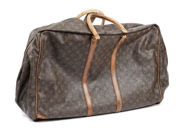 Five Louis Vuitton leather bags, c.1980, gilt lettered against a brown ground, comprising four two handled suit cases and a small folding bag, the lar