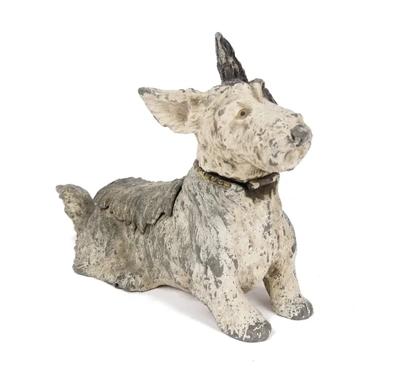 A cold painted novelty spelter table lighter and ashtray compendium, circa 1950, probably a West Highland terrier, 14cm high.