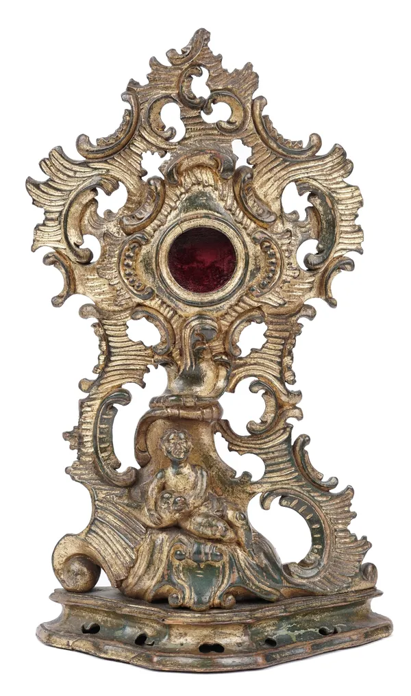 A 19th century giltwood carved pocket watch holder, detailed with a putto and seal beneath a foliate bocage on a weighted pierced base, 35cm high.