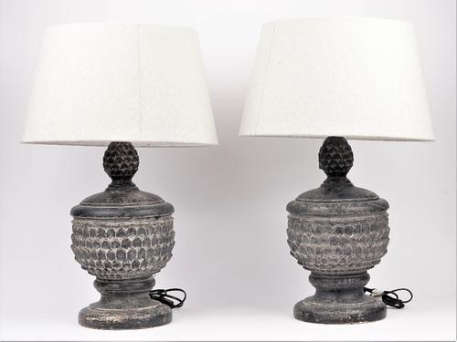A pair of modern stone effect table lamps, each distressed grey against a leafy moulded baluster body, with shades, 67cm high overall, (2).