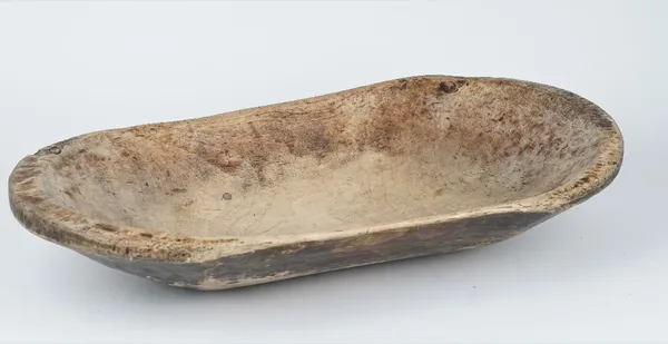 A 19th century sycamore dug out bowl of rounded rectangular form, 70cm wide.