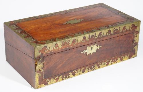 An early 19th century brass inlaid mahogany writing slope, with fitted interior, 51cm wide x 18cm high.