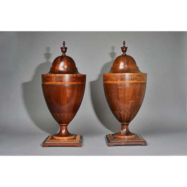 A pair of Adam Revival satinwood banded urn shaped knife boxes, the pop-up top revealing a fitted interior on turned socle and square bases, 70cm high