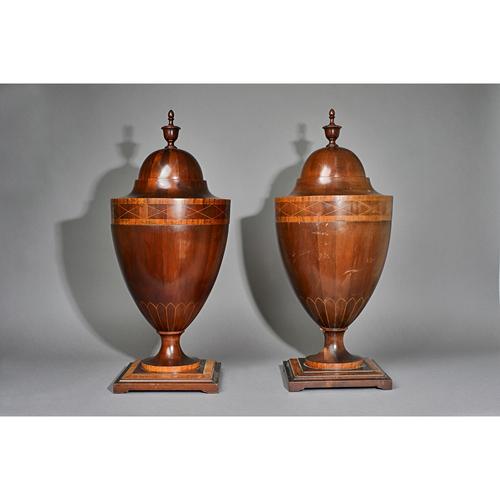 A pair of Adam Revival satinwood banded urn shaped knife boxes, the pop-up top revealing a fitted interior on turned socle and square bases, 70cm high