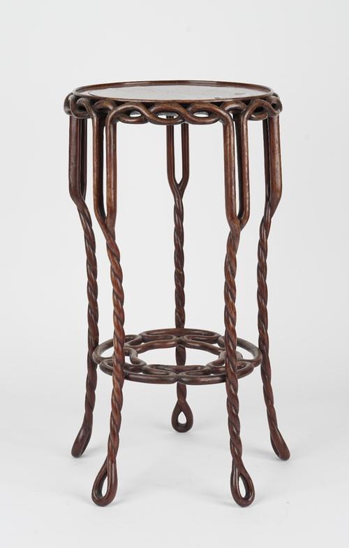 A Chinese hardwood plant stand, the circular top and frieze on pierced rope twist supports, united by similar undertier, 28cm diameter x 51cm high.