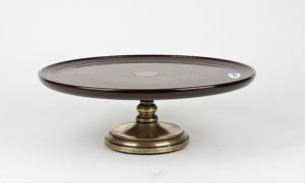 A mahogany and brass Lazy Susan with dished top and turned base, 42cm diameter x 14cm high.