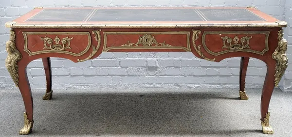 In the manner of Charles Crescent, a Louis XV style gilt metal mounted kingwood bureau plat, with three frieze drawers on cabriole supports, 185cm wid