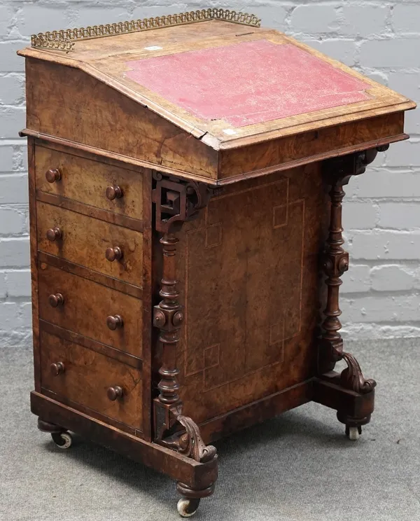 A Victorian inlaid burr walnut Davenport, the sloped top over pen drawer and five further side drawers with dummy opposing, on block and turned suppor