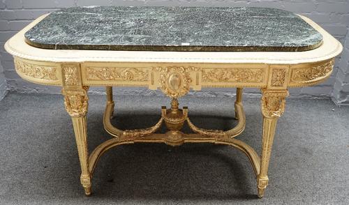 An 18th century French style marble topped gilt centre table on fluted supports united by urn mounted stretcher, 154cm wide x 78cm high.
