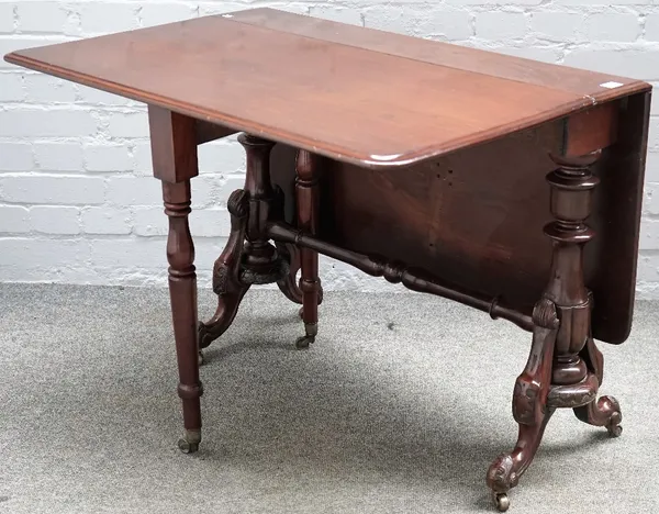 A Victorian mahogany Sutherland table, on reeded baluster supports, 91cm wide x 69cm high.