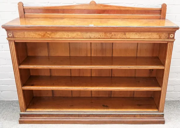 A Victorian figured walnut floor standing open three tier bookcase, 138cm wide x 109cm high.