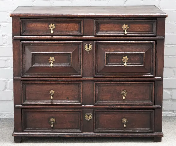 A Charles II oak chest with four long geometric moulded drawers on stile feet, 92cm wide x 79cm high.